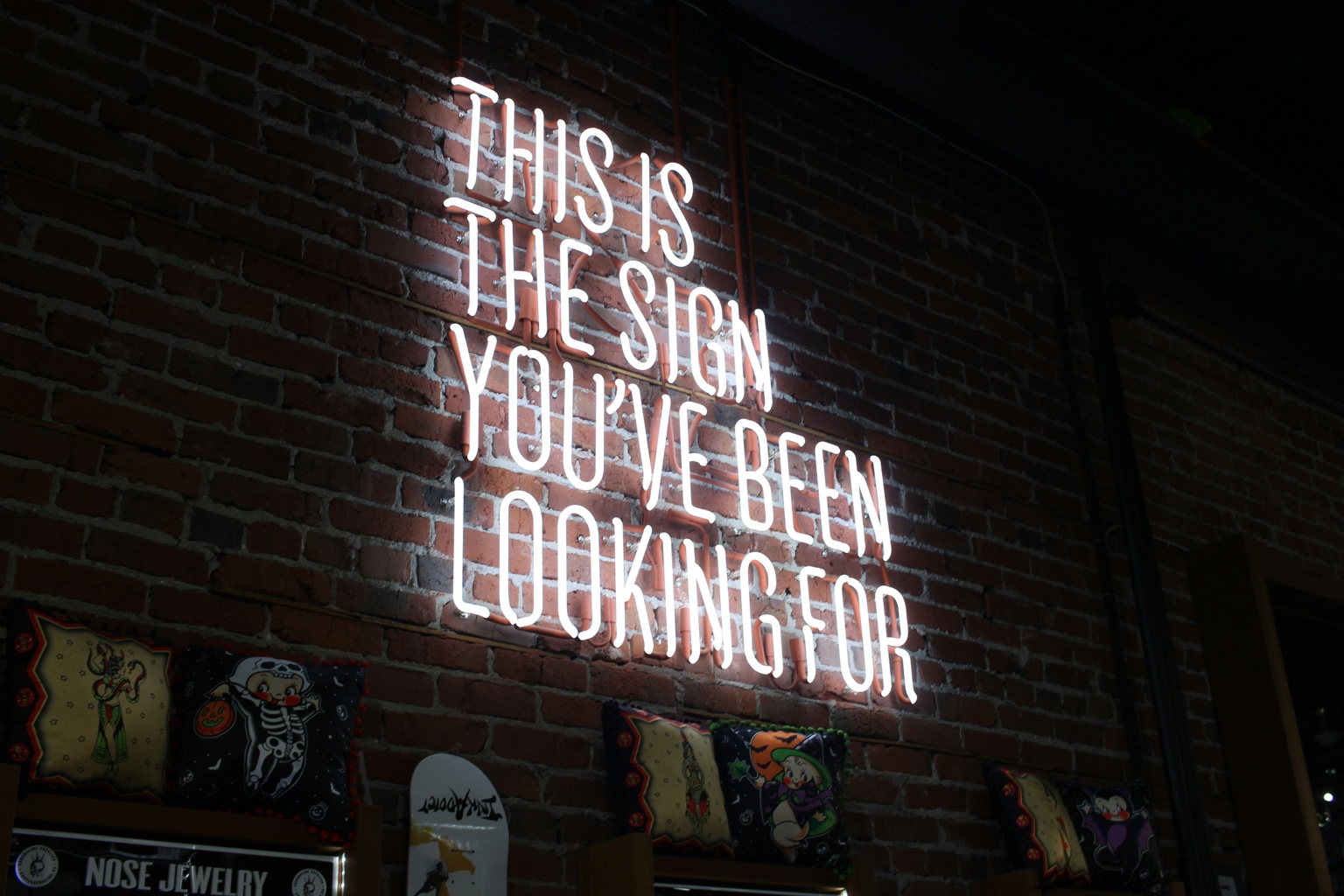 Neon sign reading this is the sign you’ve been looking for